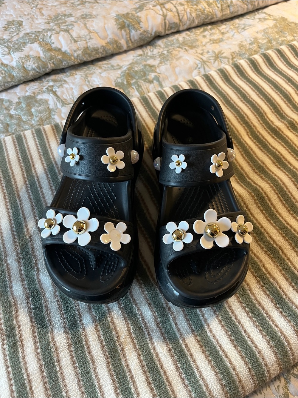 CROCS Mega Crusg Black Sandals with White Floral Charms and Gold Accents